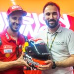 iXOOST and Andrea Dovizioso with the prize for the 200 MotoGP races, helmet-speaker